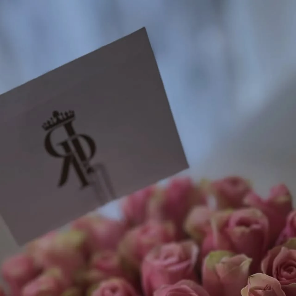 Blush roses with a Royal Petals house card